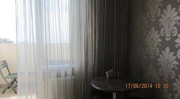 Апартаменты с балконом в Апартаментах Apartment On Oktyabrskaya 57